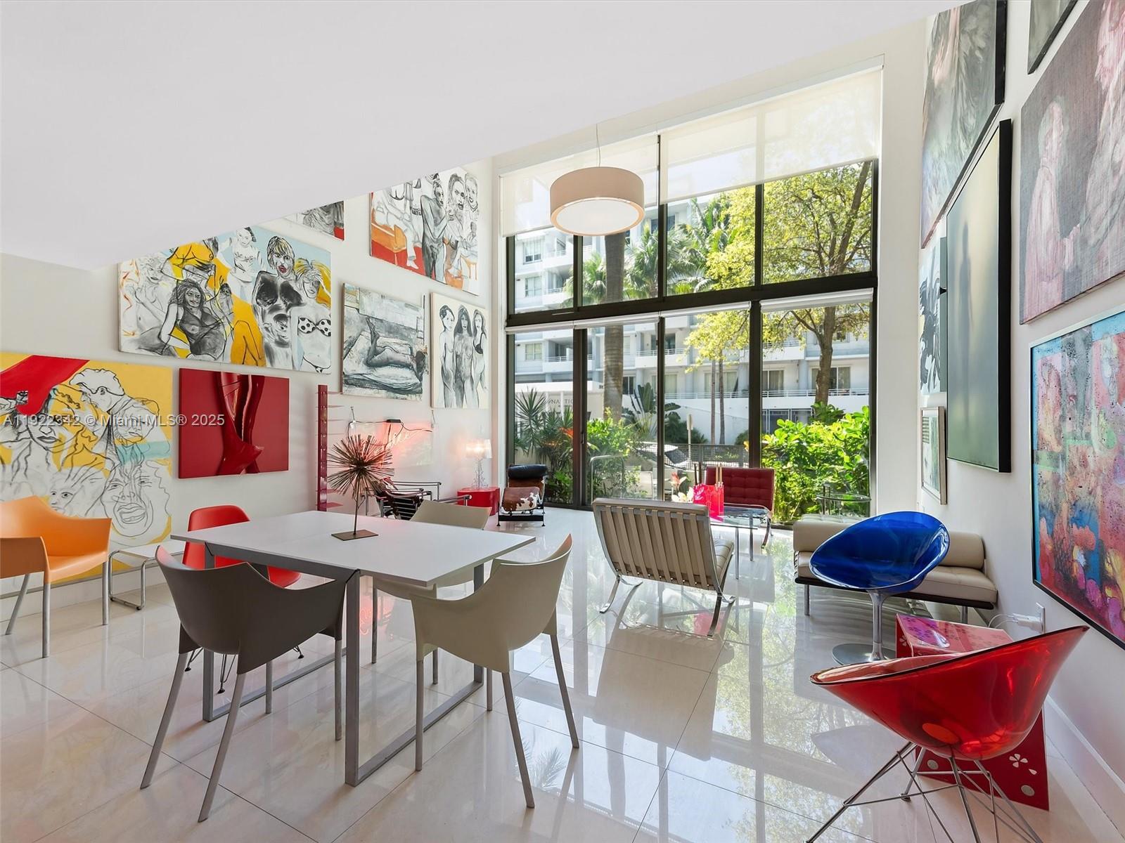 6000 Collins Avenue, Unit 132 Miami Beach, FL 33140 - Photo 1 of 14 a view of a dining room with furniture and a potted plant