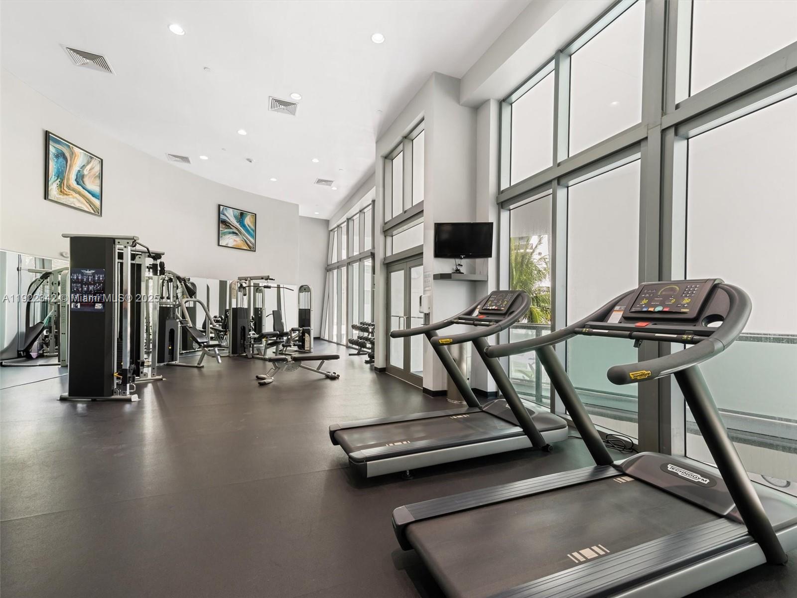 6000 Collins Avenue, Unit 132 Miami Beach, FL 33140 - Photo 10 of 14 a view of a room with gym equipment