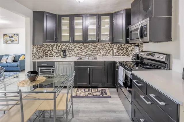 a kitchen with a sink and cabinets