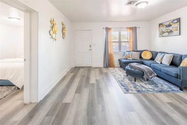 a living room with couch and a window