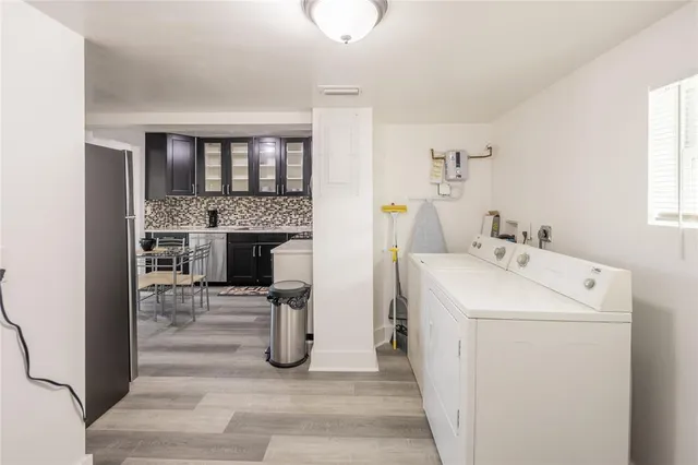 a utility room with dryer and washer