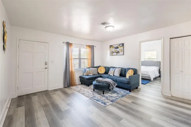 a bed room with furniture and a window