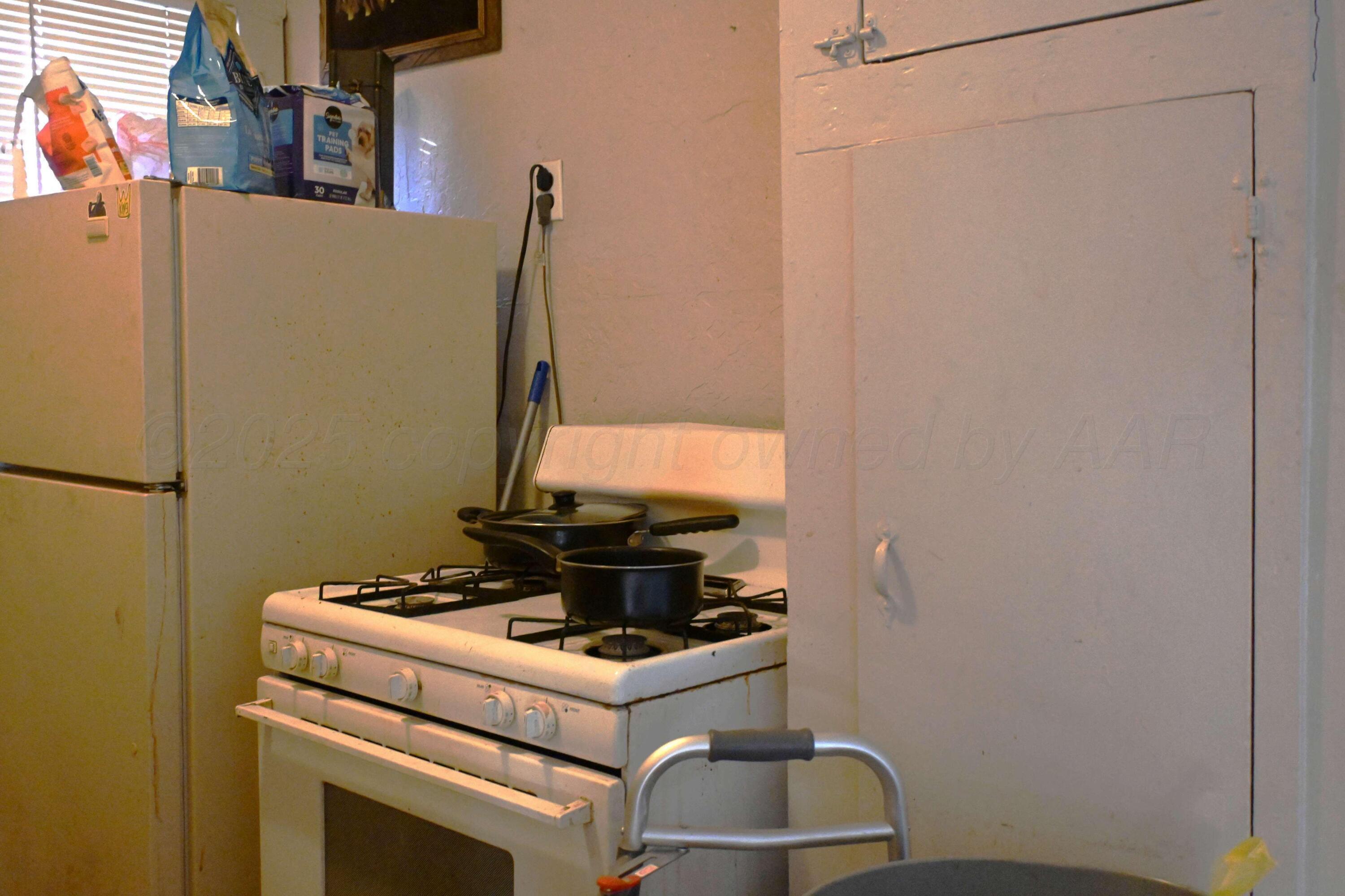 3702 South Polk Street Amarillo, TX 79110 - Photo 14 of 19 a view of storage and utility room with washer and dryer
