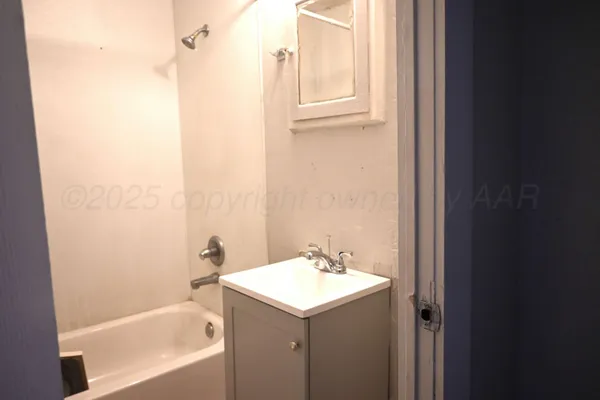 a bathroom with a sink and a bathtub