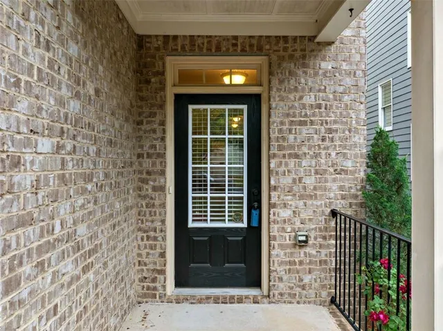a front view of a house with a large window