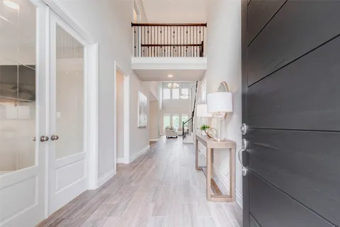 a large kitchen with stainless steel appliances kitchen island granite countertop a sink and a stove