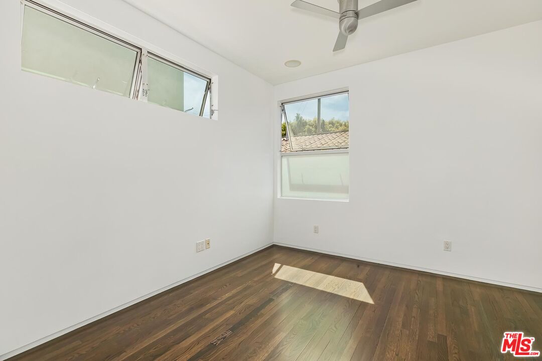 705 Sunset Avenue, Unit 1/2 Venice, CA 90291 - Photo 12 of 16 a view of a room with wooden floor and window