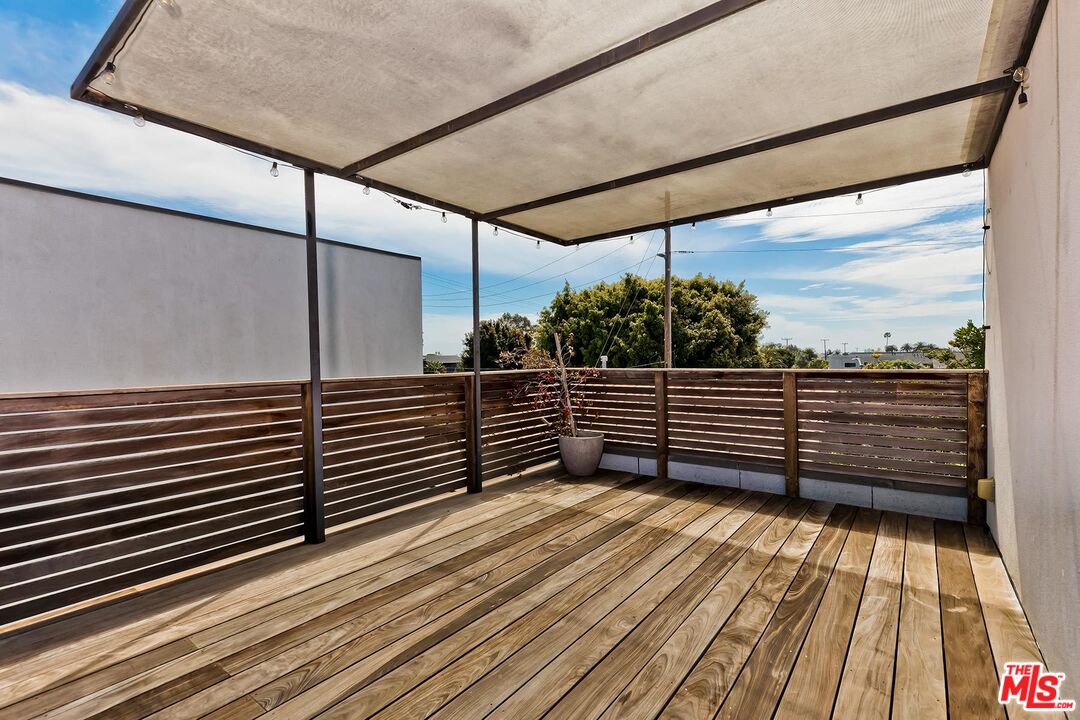 705 Sunset Avenue, Unit 1/2 Venice, CA 90291 - Photo 15 of 16 a view of a balcony with wooden floor