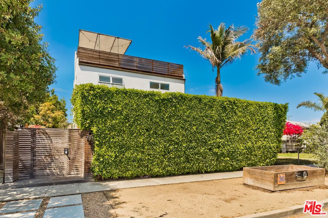 705 Sunset Avenue, Unit 1/2 Venice, CA 90291 - Photo 3 of 16 a front view of a house with a yard