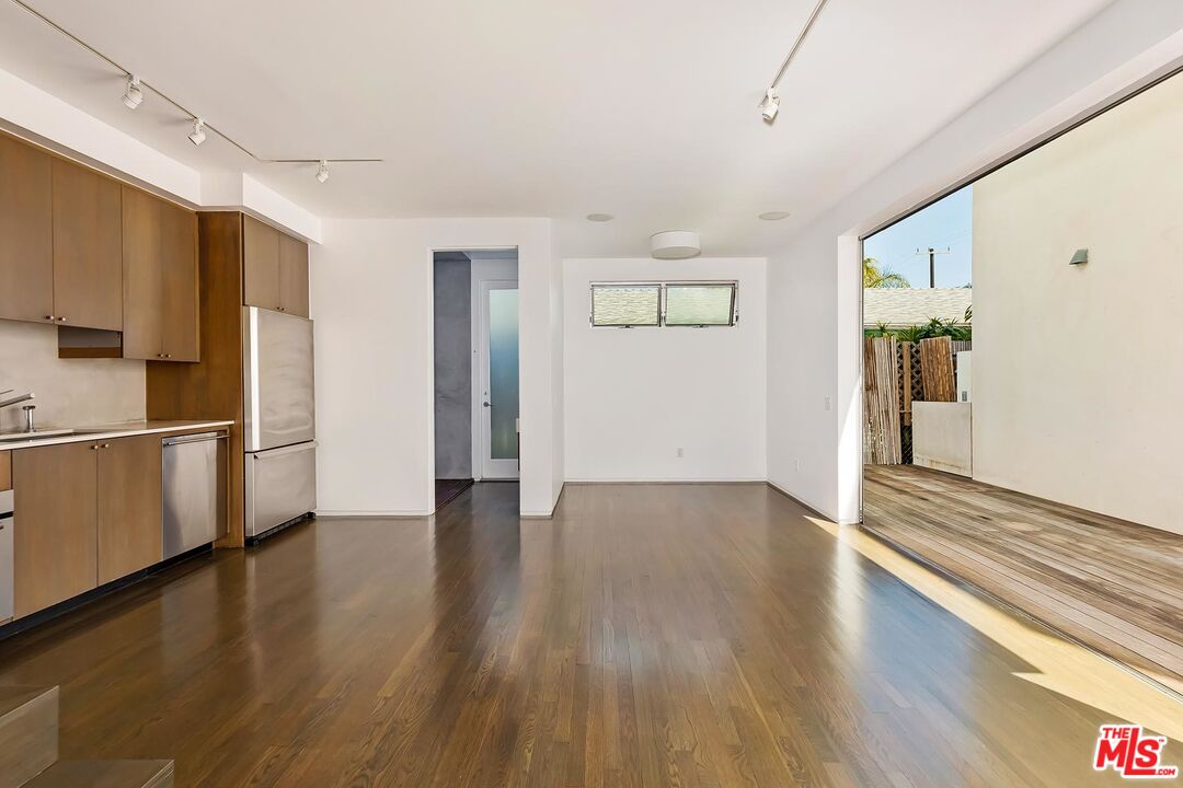 705 Sunset Avenue, Unit 1/2 Venice, CA 90291 - Photo 6 of 16 a view of a kitchen with wooden floor and a sink