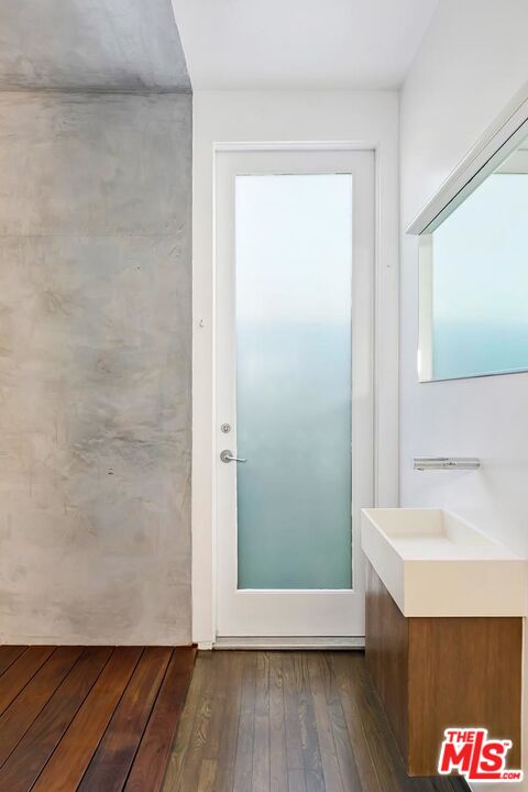 705 Sunset Avenue, Unit 1/2 Venice, CA 90291 - Photo 7 of 16 a bathroom with a sink and a mirror