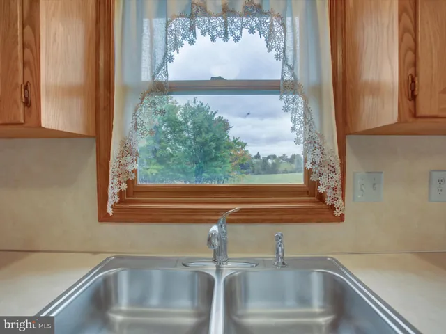 a bedroom with bed and window