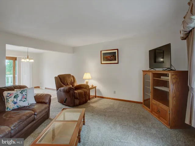 a bathroom with a sink toilet a mirror and shower