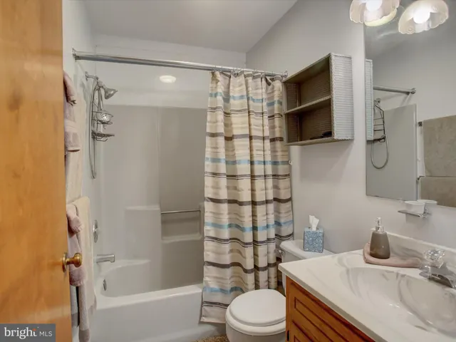 a bed room with a bed and a night stand