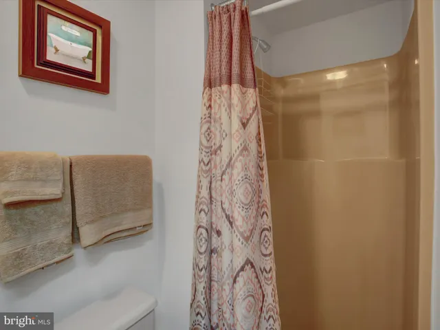 a view of staircase with white walls and windows