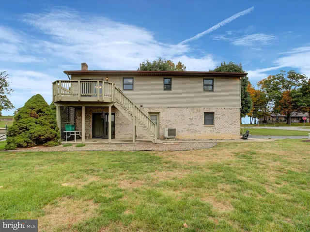 a view of a balcony with wooden floor and staircase