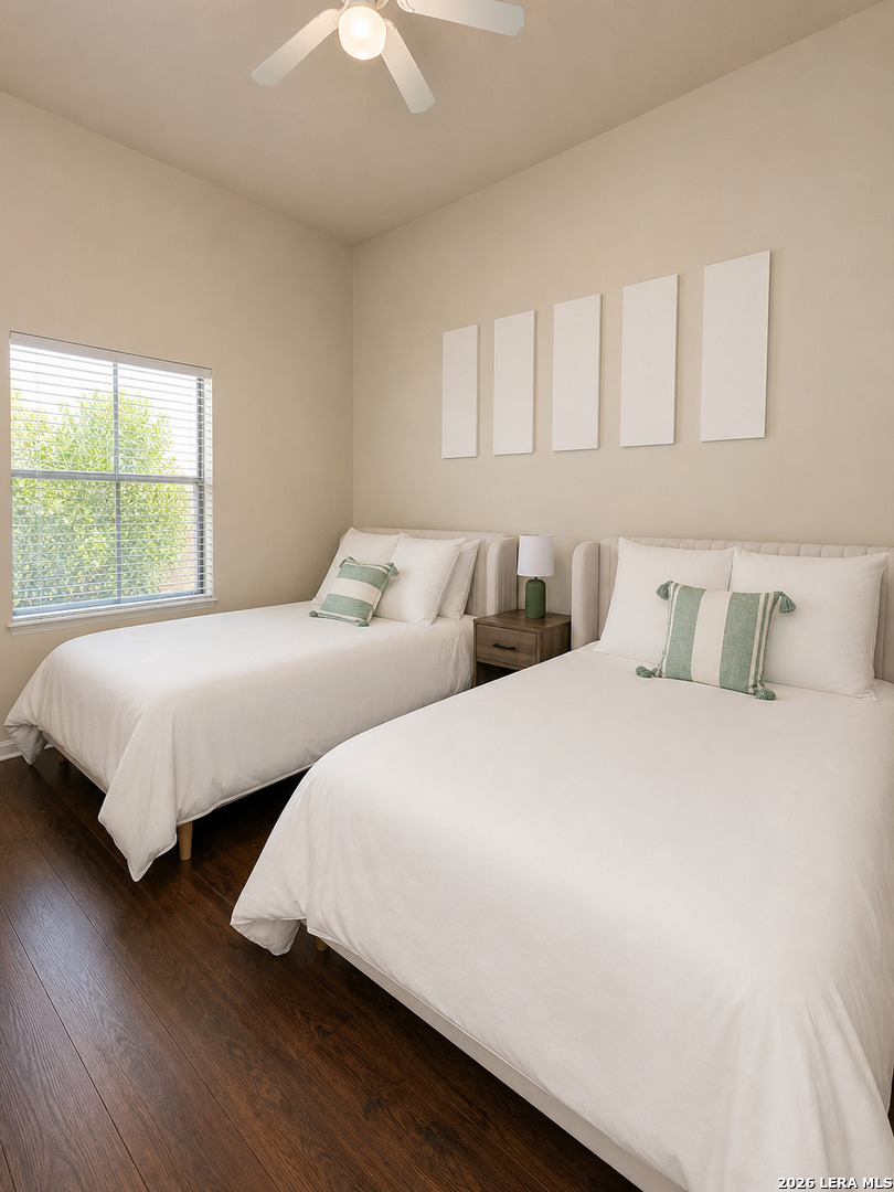 6160 Eckhert Road, Unit 804 San Antonio, TX 78240 - Photo 25 of 38 a bedroom with two beds and a large window