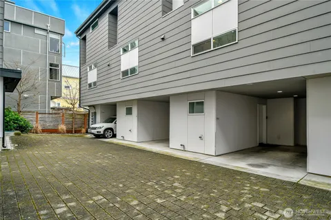 a kitchen with stainless steel appliances granite countertop a sink and refrigerator