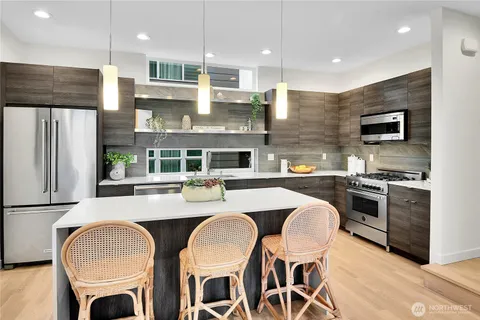 a living room with furniture a rug and white walls