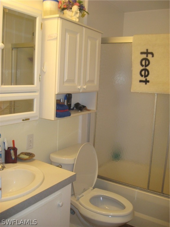 1260 Old Bridge Road North Fort Myers, FL 33917 - Photo 11 of 29 a bathroom with a toilet a sink and a shower