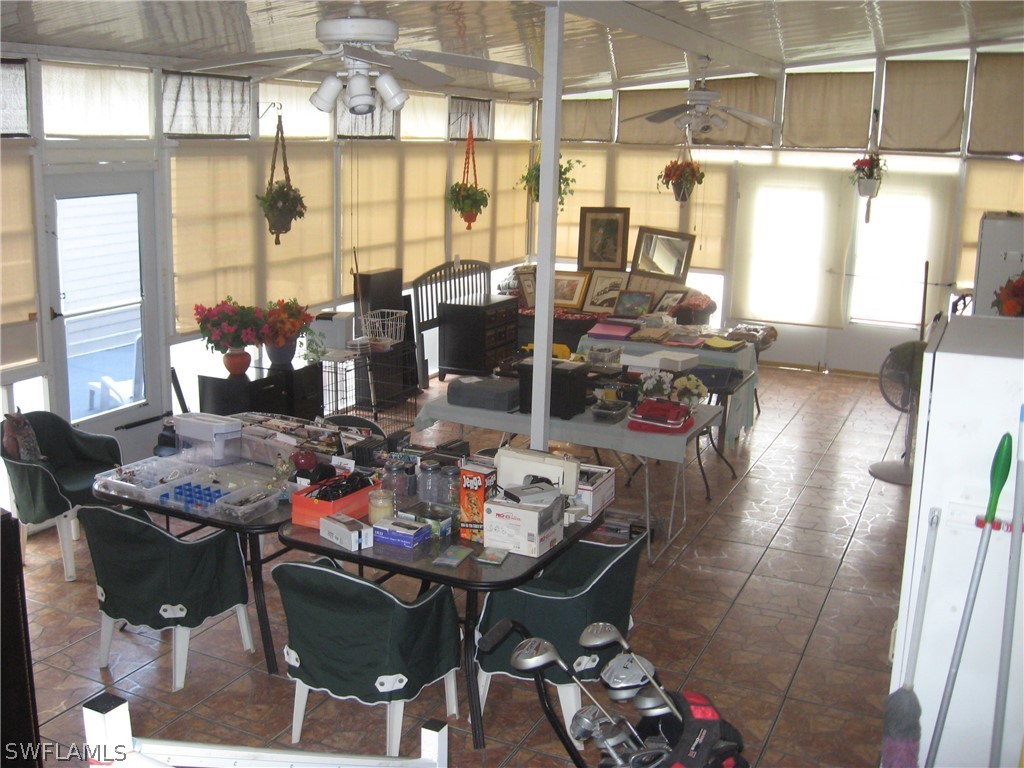 1260 Old Bridge Road North Fort Myers, FL 33917 - Photo 17 of 29 a view of a dining room with furniture and a window
