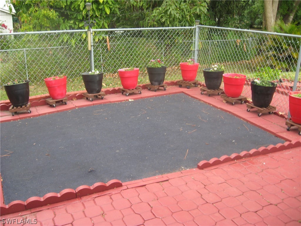 1260 Old Bridge Road North Fort Myers, FL 33917 - Photo 18 of 29 a roof deck with a potted plant