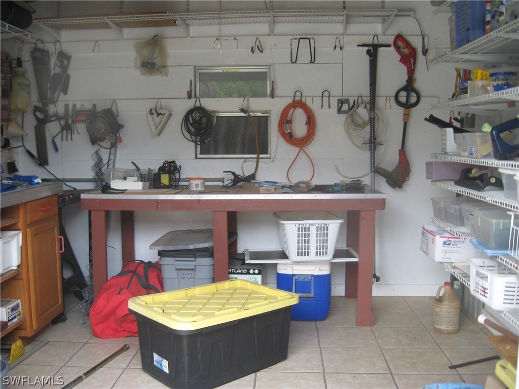 1260 Old Bridge Road North Fort Myers, FL 33917 - Photo 24 of 29 a kitchen with a stove and cabinets