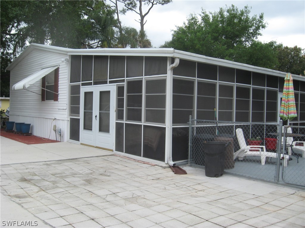 1260 Old Bridge Road North Fort Myers, FL 33917 - Photo 26 of 29 a view of house with outdoor seating and plants