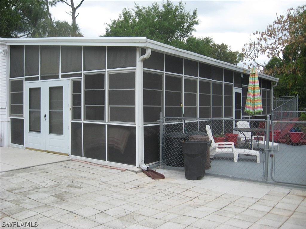 1260 Old Bridge Road North Fort Myers, FL 33917 - Photo 27 of 29 a view of a house with backyard in the background