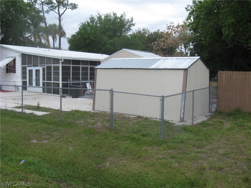 1260 Old Bridge Road North Fort Myers, FL 33917 - Photo 28 of 29 a view of a house with a yard