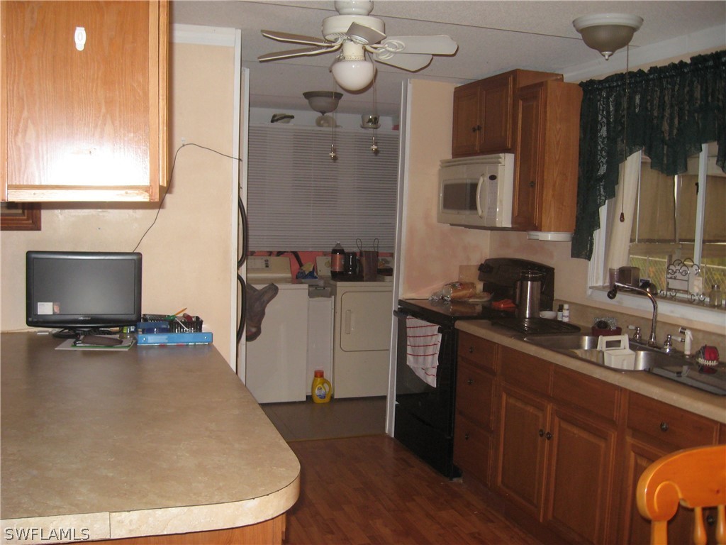 1260 Old Bridge Road North Fort Myers, FL 33917 - Photo 6 of 29 a kitchen with a sink cabinets and window