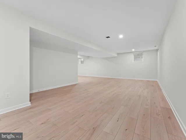 a view of a yard with wooden fence
