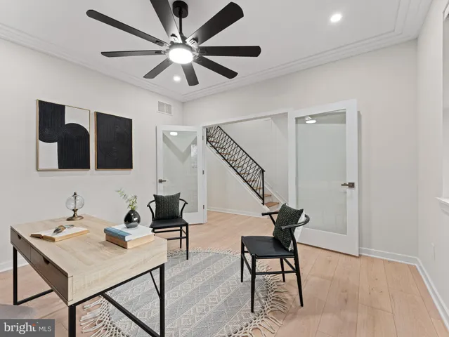 a kitchen with stainless steel appliances kitchen island granite countertop a table chairs sink and cabinets