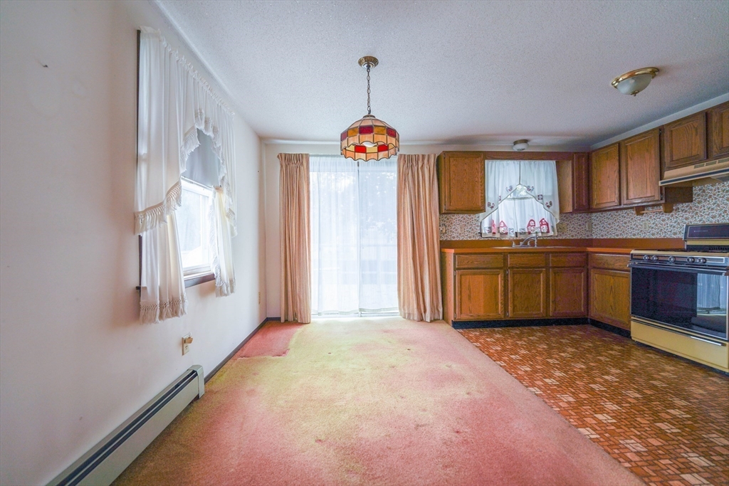 1069 Cherokee Street New Bedford, MA 02745 - Photo 12 of 21 a bedroom with a bed and a window