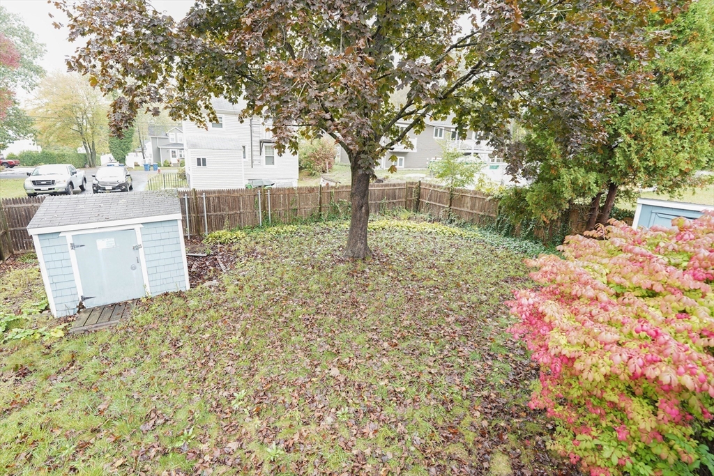 1069 Cherokee Street New Bedford, MA 02745 - Photo 19 of 21 a backyard of a house with lots of green space