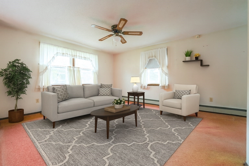 1069 Cherokee Street New Bedford, MA 02745 - Photo 2 of 21 a living room with furniture and a window