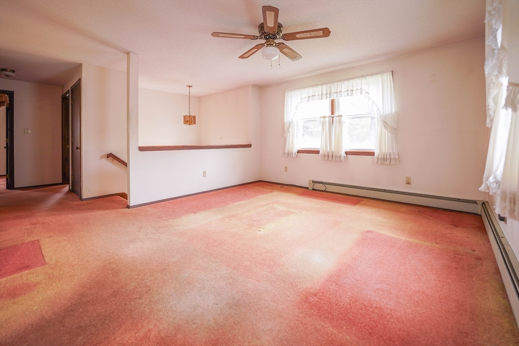 1069 Cherokee Street New Bedford, MA 02745 - Photo 5 of 21 an empty room with windows and entrance