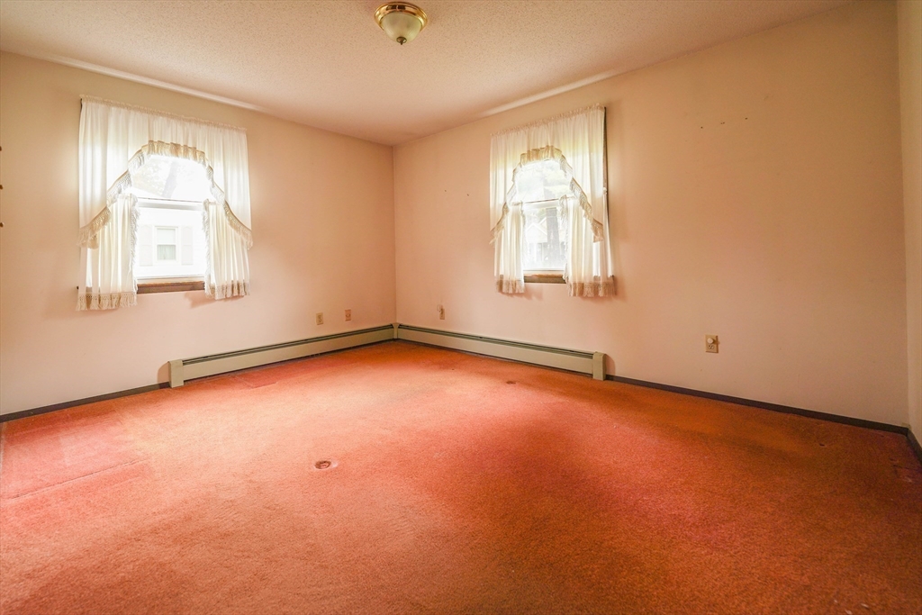 1069 Cherokee Street New Bedford, MA 02745 - Photo 7 of 21 an empty room with a window
