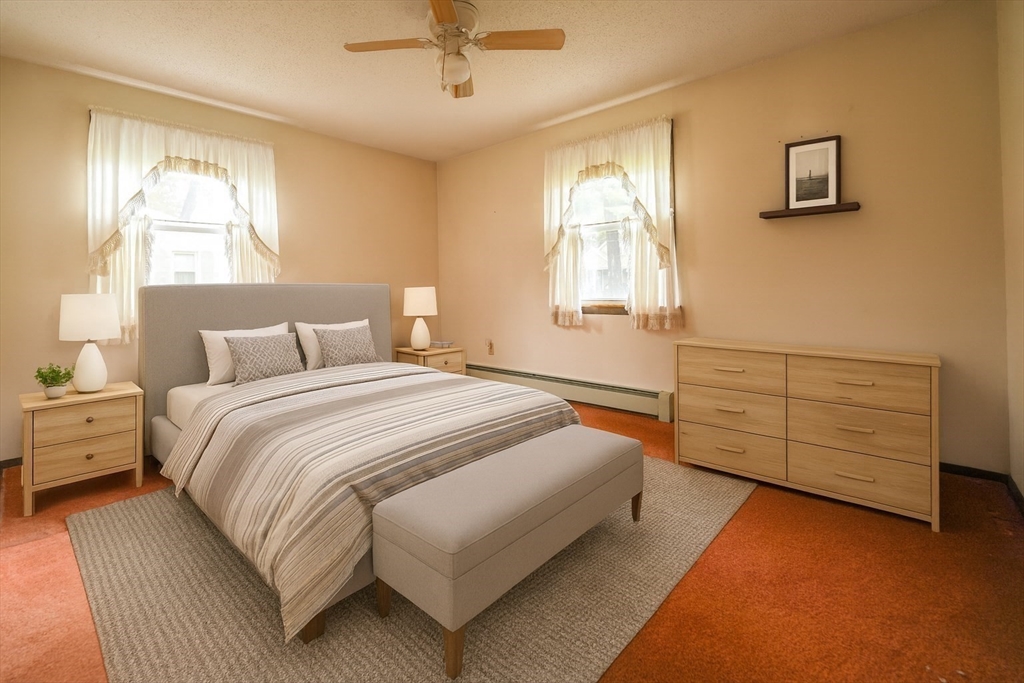 1069 Cherokee Street New Bedford, MA 02745 - Photo 8 of 21 a bedroom with a bed and a window