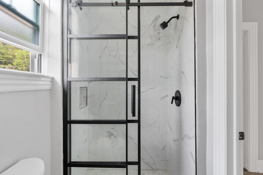 187 Indian Lane Canton, MA 02021 - Photo 12 of 26 a bathroom with a shower