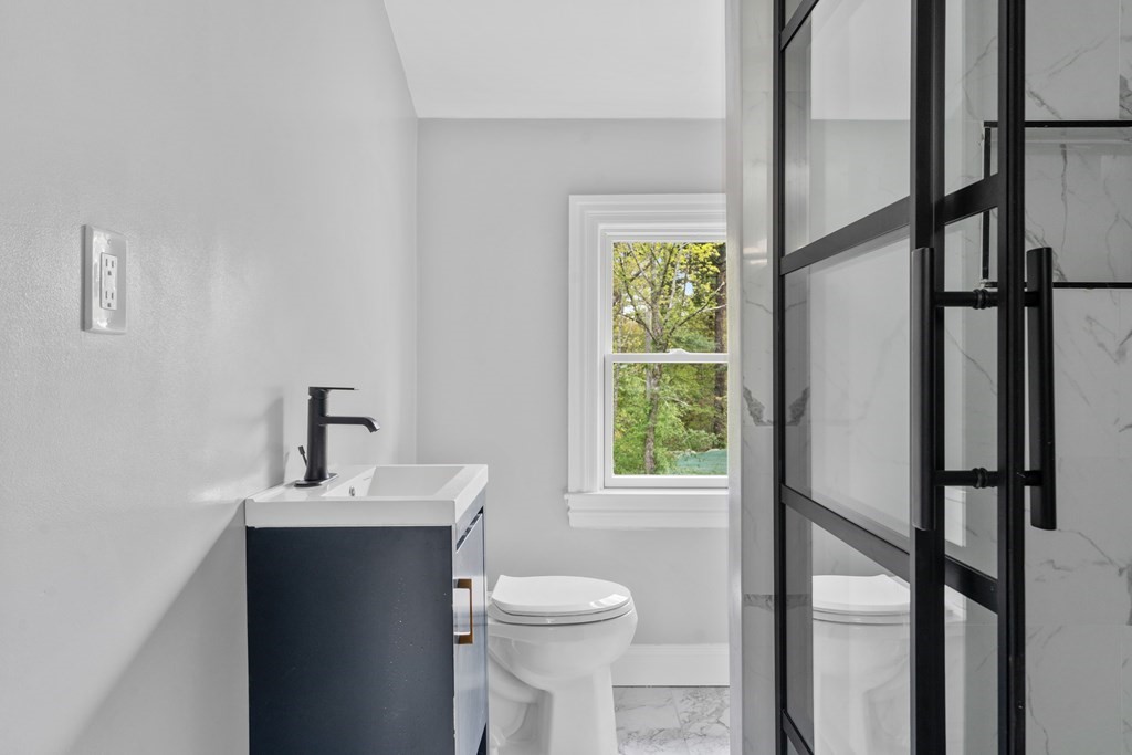 187 Indian Lane Canton, MA 02021 - Photo 19 of 26 a bathroom with a sink toilet and a mirror