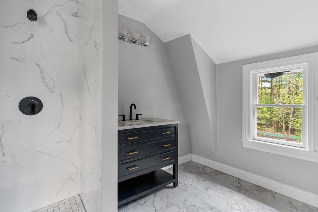 187 Indian Lane Canton, MA 02021 - Photo 23 of 26 a room with a dresser and a window