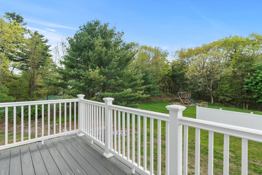187 Indian Lane Canton, MA 02021 - Photo 24 of 26 a balcony with wooden floor and fence