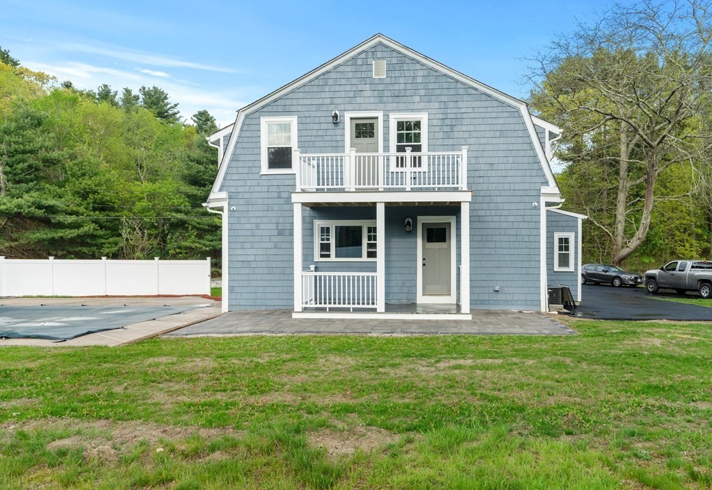 187 Indian Lane Canton, MA 02021 - Photo 3 of 26 a front view of a house with a yard