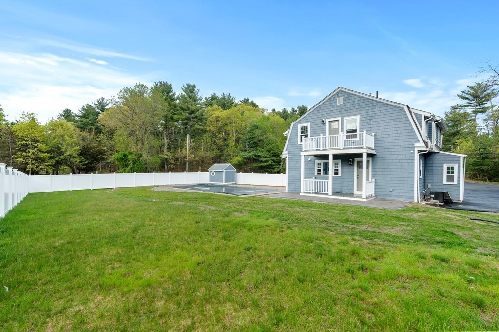 187 Indian Lane Canton, MA 02021 - Photo 4 of 26 a front view of a house with a yard
