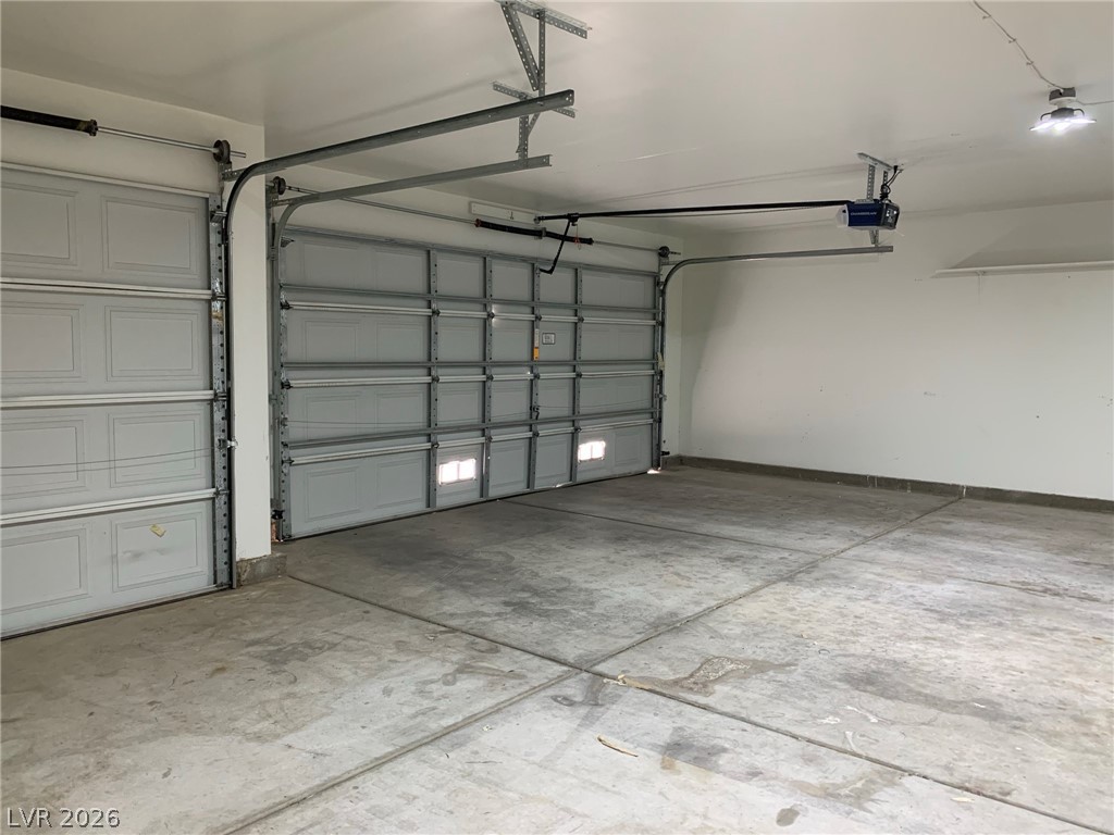 3821 Bombastic Court Las Vegas, NV 89147 - Photo 29 of 36 This spacious garage offers ample room for vehicles and storage.