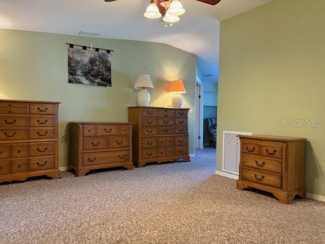 1894 Elizabeth Lane Mount Dora, FL 32757 - Photo 13 of 69 a view of an empty room with furniture and a dresser