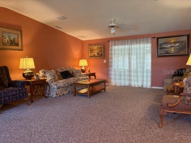 1894 Elizabeth Lane Mount Dora, FL 32757 - Photo 2 of 69 a bed room with furniture and a lamp