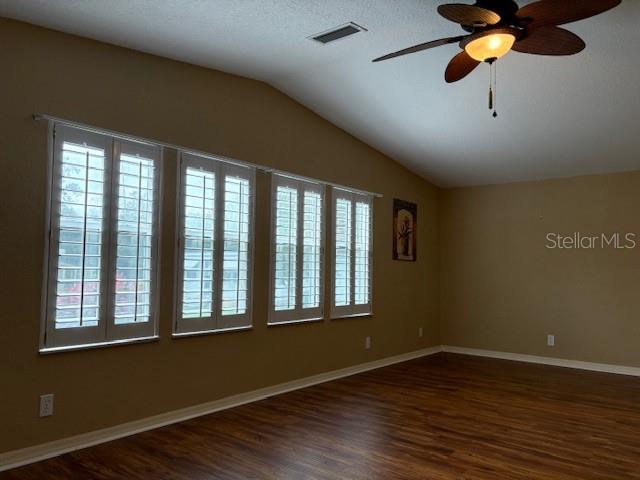 1894 Elizabeth Lane Mount Dora, FL 32757 - Photo 32 of 69 a view of an empty room with wooden floor and a window