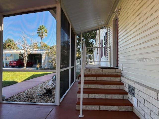 1894 Elizabeth Lane Mount Dora, FL 32757 - Photo 52 of 69 a view of a house with a porch and furniture